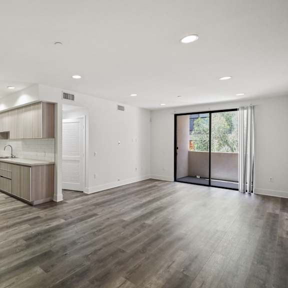 open-concept kitchen, dining, and living room areas