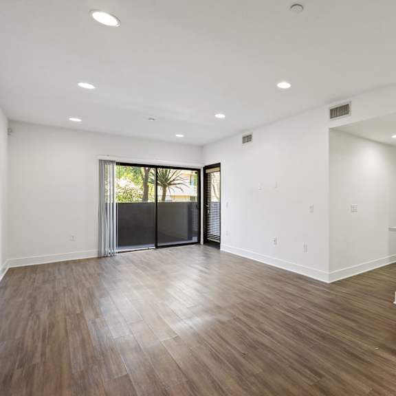 open-concept kitchen, dining, and living room areas