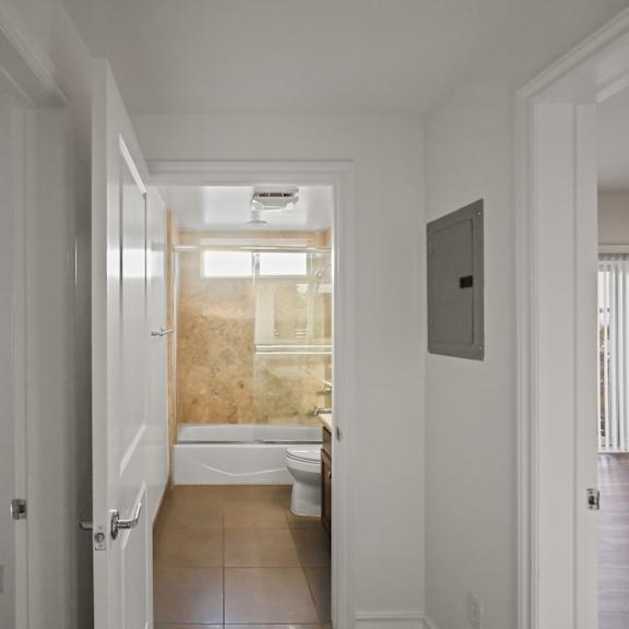 hall bathroom with full-size bathtub