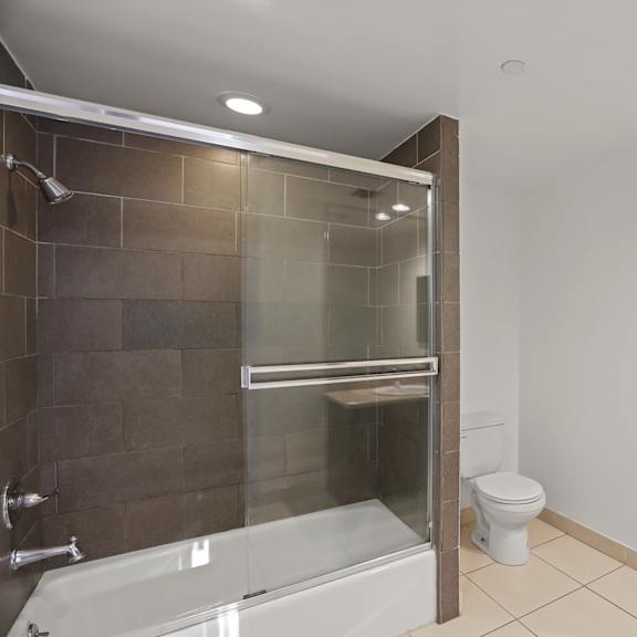spacious bathroom with full-size bathtub