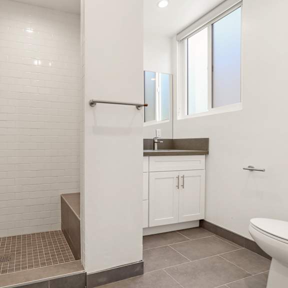 apartment bathroom with walk-in shower