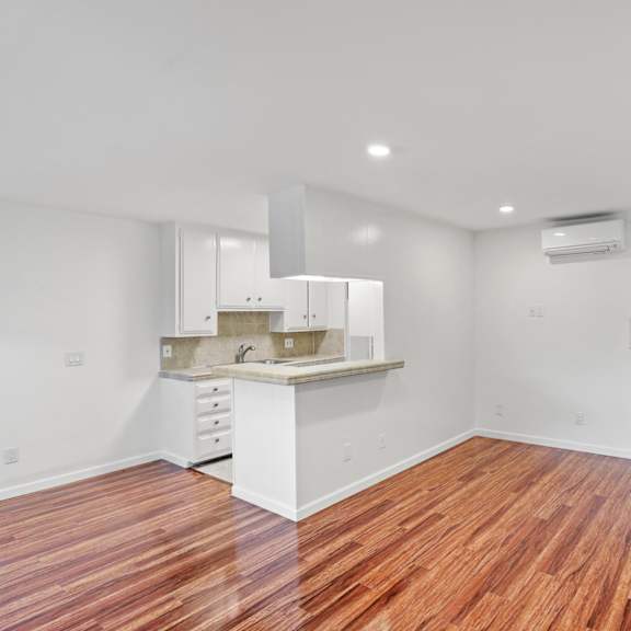 open-concept kitchen & dining areas with vinyl flooring