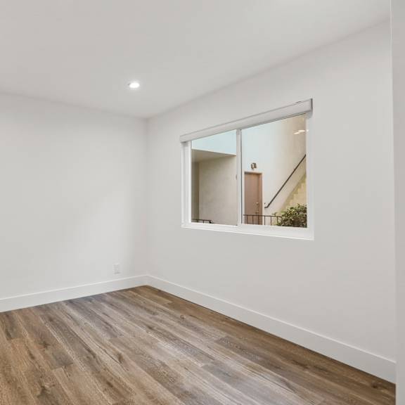bedroom with recessed lighting and window
