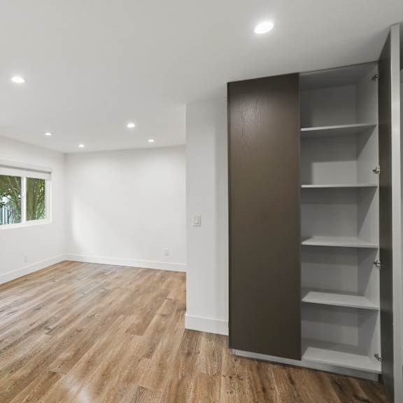open-concept living room space with storage