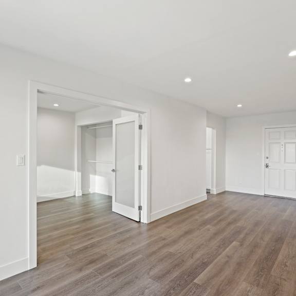 spacious living area with open-concept floor plan and vinyl flooring
