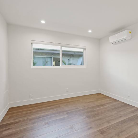 bedroom with wall heater