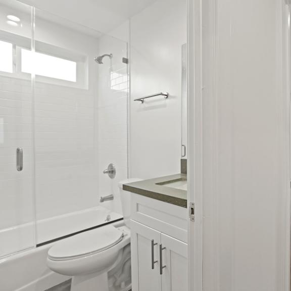 apartment bathroom with full-size bathtub