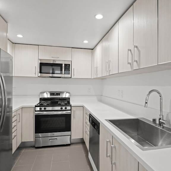 west la apartment kitchen with energy-efficient appliances and  lots of cabinet