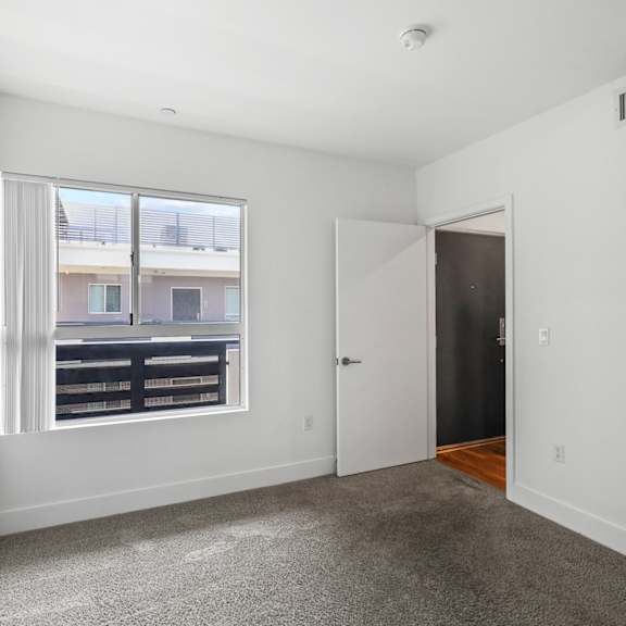 bedroom with courtyard facing window