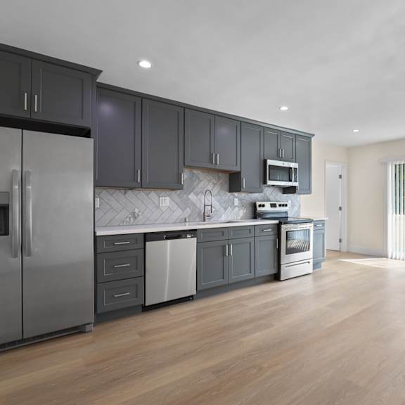 open-concept kitchen, dining, and living room space