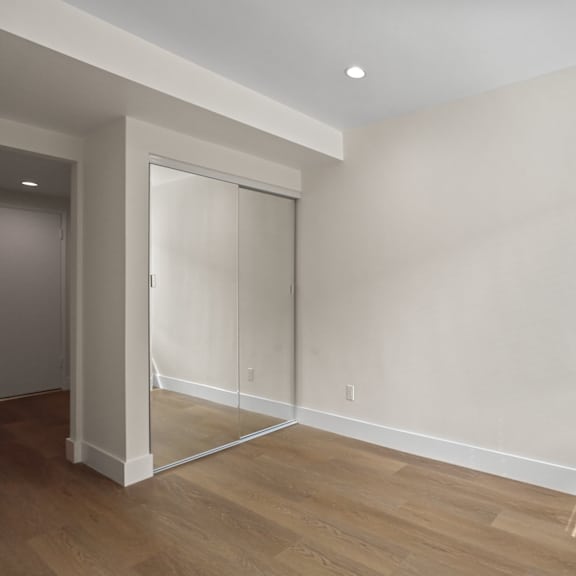 bedroom with large mirrored closet
