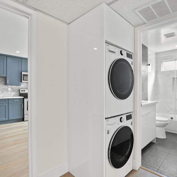 bathroom with full-size washer and dryer
