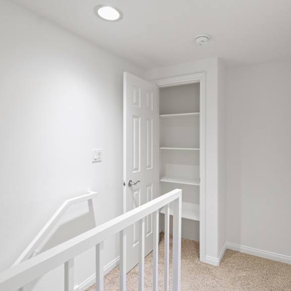 second-floor with hall closet with built-in shelving