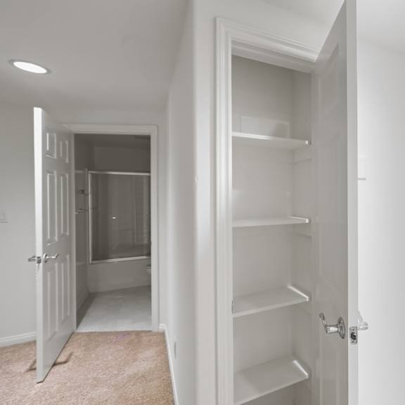 second-floor with bathroom and hall closet with shelves