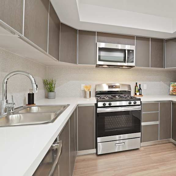 west la apartment with modern kitchen with stainless steel appliances
