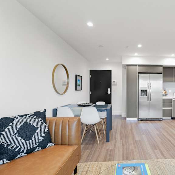open-concept kitchen, dining, and living room spaces