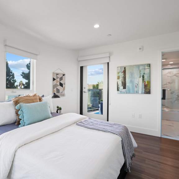 large-size bedroom with lots of windows