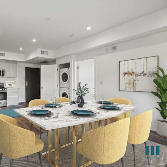 open-concept kitchen and dining room with in-suite washer & dryer