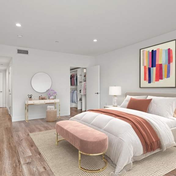 bedroom with walk-in closet with built-in organizers