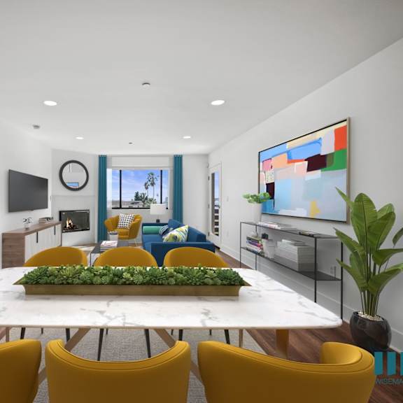 open-concept dining and living room with fireplace and patio