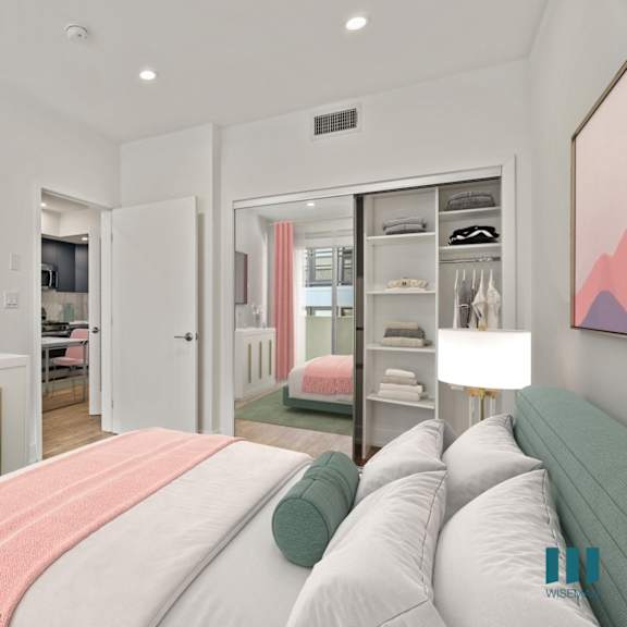 bedroom with mirrored closet with built-in shelving