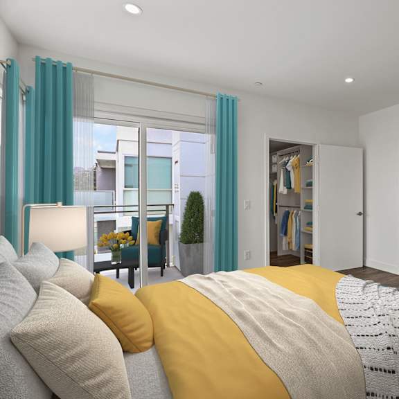 bedroom with patio, walk-in closet, and bathroom