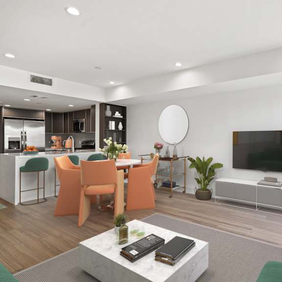 kitchen with countertop bar, dining room, and living room