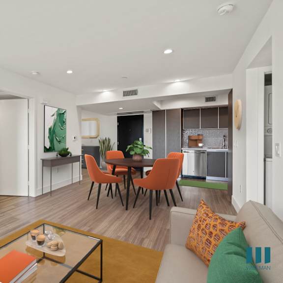 open-concept kitchen, dining, and living room space with vinyl flooring and recessed lighting