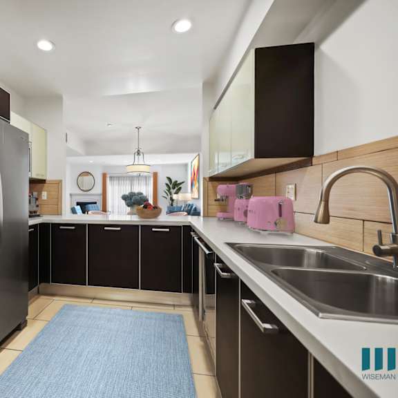 open-concept kitchen with stainless-steel appliances