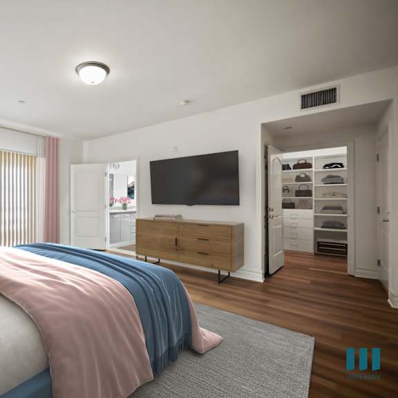 bedroom with walk-in closet, bathroom, and balcony