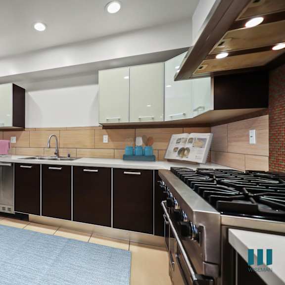 large-size kitchen with stainless-steel appliances and ample cabinet storage
