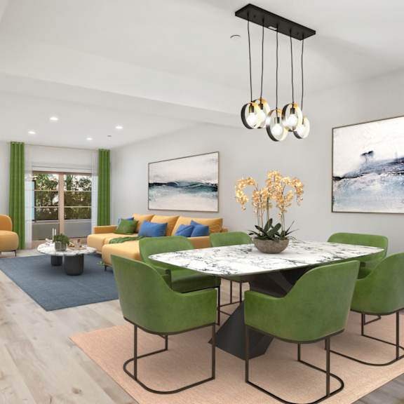 dining and living room with fireplace and patio