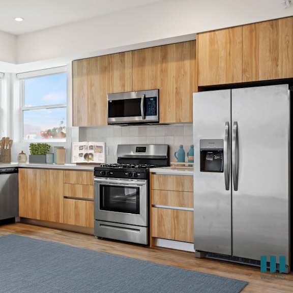 a kitchen with stainless steel appliances and wooden cabinets