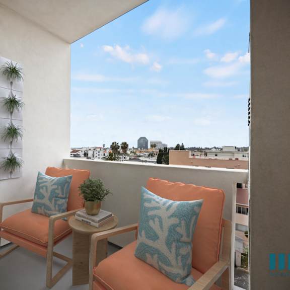 a balcony with two orange chairs and a window with plants