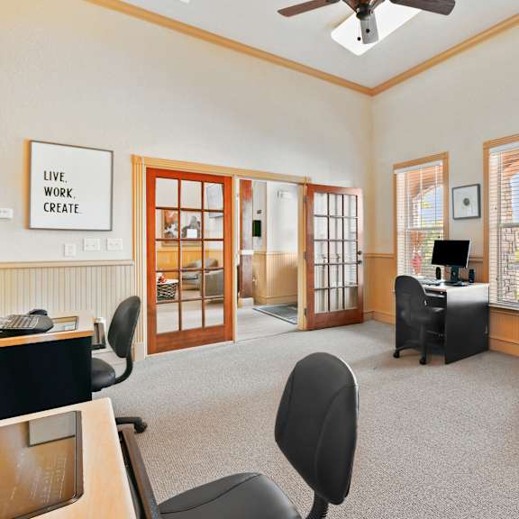 a room with a sign that says "live work create" on the wall.
