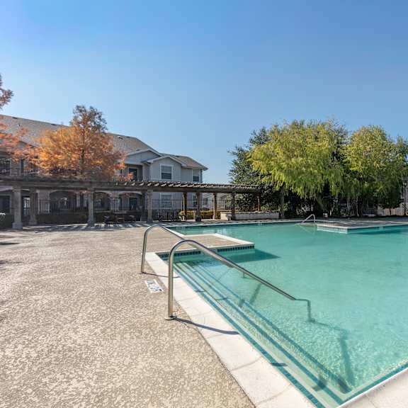 a swimming pool with a glass barrier and a sign that says 3r.