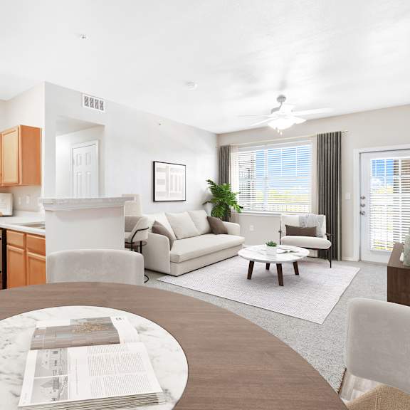 a modern living room with a kitchen area in the background.