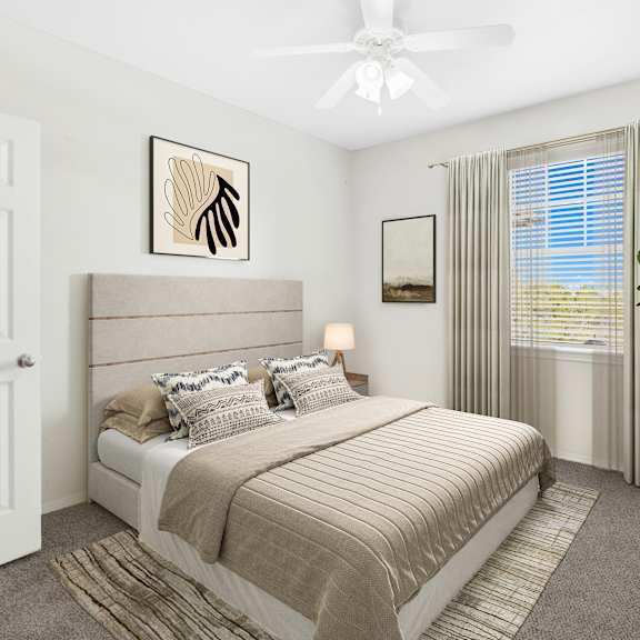 a bedroom with a large bed, a ceiling fan, and a window with curtains.