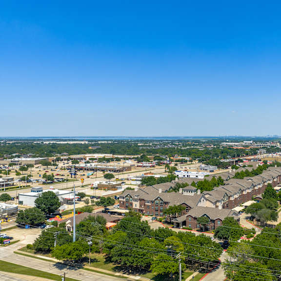 a suburban area with houses and trees.