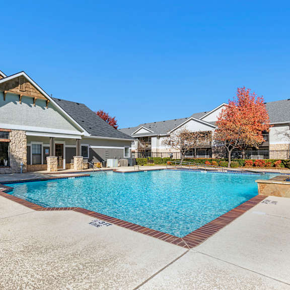 a large swimming pool in the middle of a residential area.