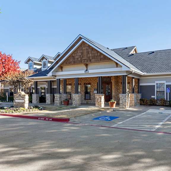 a building with a parking lot in front of it.