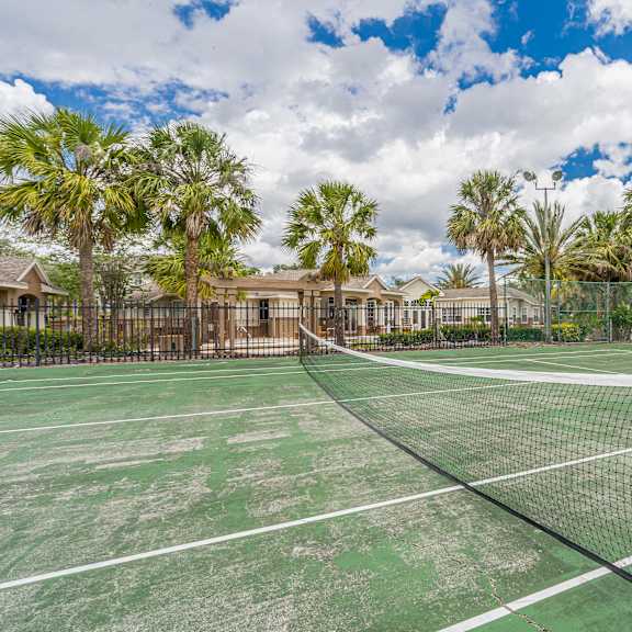 a tennis court with a net in the middle of it.
