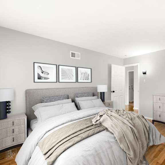 a bedroom with a bed and a dresser