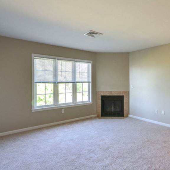 stonington park apartments – living room – getzville area – appliances included - 24 hour emergency maintenance – fireplace - balcony – carpeting - pet friendly - garages – ask for a tour - basic fios