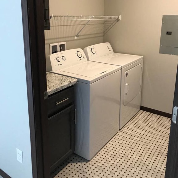 laundry room with storage