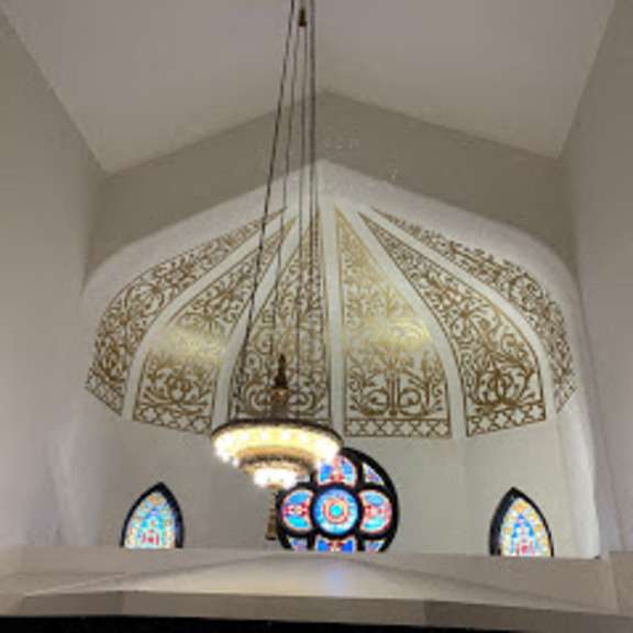 church interior with original chandelier and stain glass windows at san sofia luxury apartments, cleveland, oh