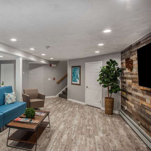 lower floor clubhouse with sofa and coffee table