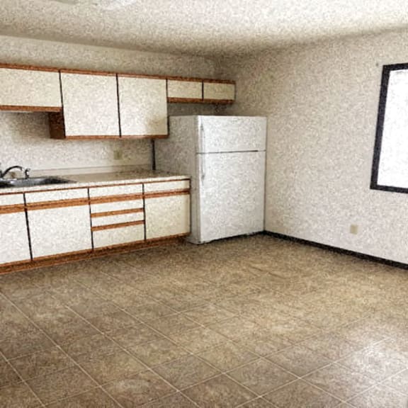 kitchen with white cabinets and white appliances