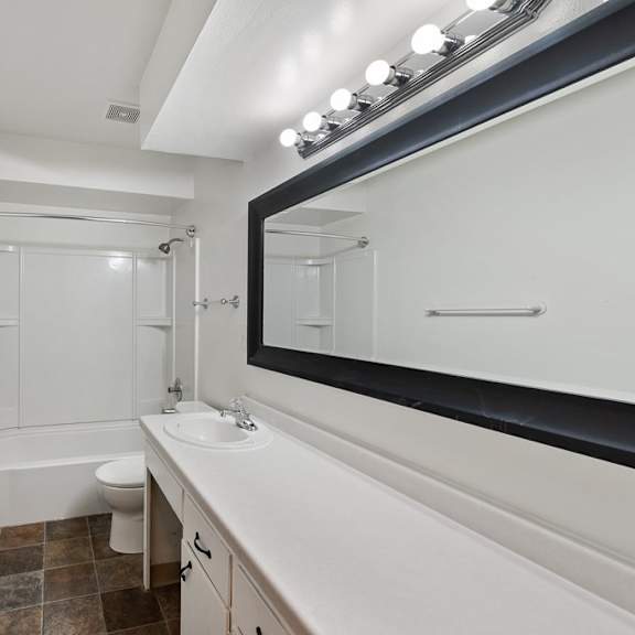 a bathroom with a sink toilet and bathtub