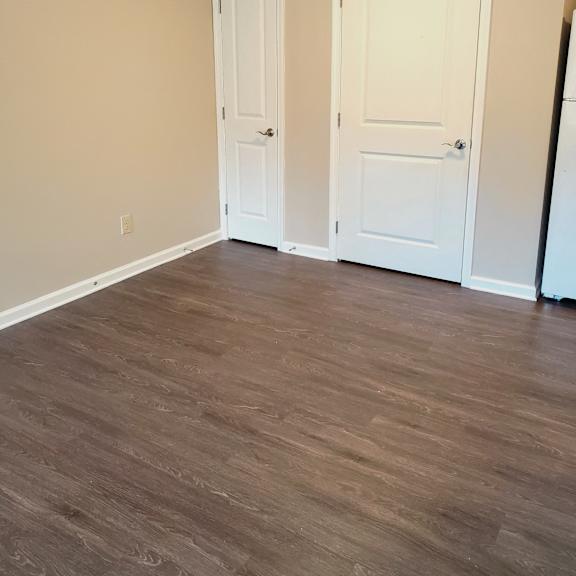 bedroom wood floor closets and light